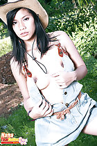 Removing her dress exposing her breasts