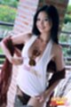 Lin si yee pulling her top taut over her breasts