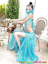 Seated at table wearing traditional indian clothes