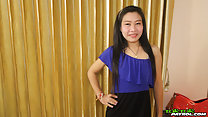 Standing with hand on hip long hair in hair band wearing dress